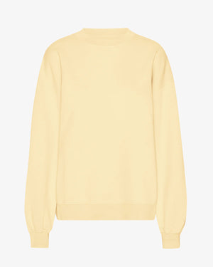 Organic Oversized Sweatshirt Soft Yellow aus 100% Bio-Baumwolle, langärmelig und vorgewaschen, präsentiert sich schlicht und umweltfreundlich, ideal für jeden Tag.