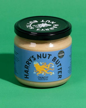 Harry's Nut Butter – Crunchy Erdnuss - 330g in Glas mit blauem Etikett und gelbem Oktopus, ideal für Toast oder Porridge. Vegan, ohne Konservierungsstoffe.