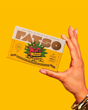 DRUNKN' MONKEY Dunkle Schokolade (60%) mit Gewürzrum, Bananenchips, gesalzene Cracker