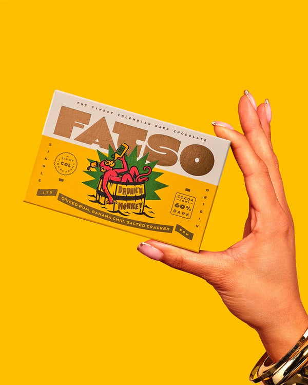 DRUNKN' MONKEY Dunkle Schokolade (60%) mit Gewürzrum, Bananenchips, gesalzene Cracker