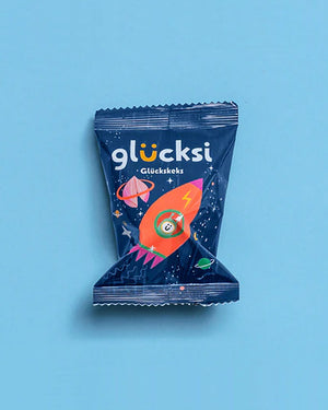 glücksi - der Glückskeks für Kinder: Einzelverpacktes Snackpaket mit Weltraummotiv, enthält einen Glückskeks mit geheimen Botschaften, ideal für kindliche Freude und Überraschung.