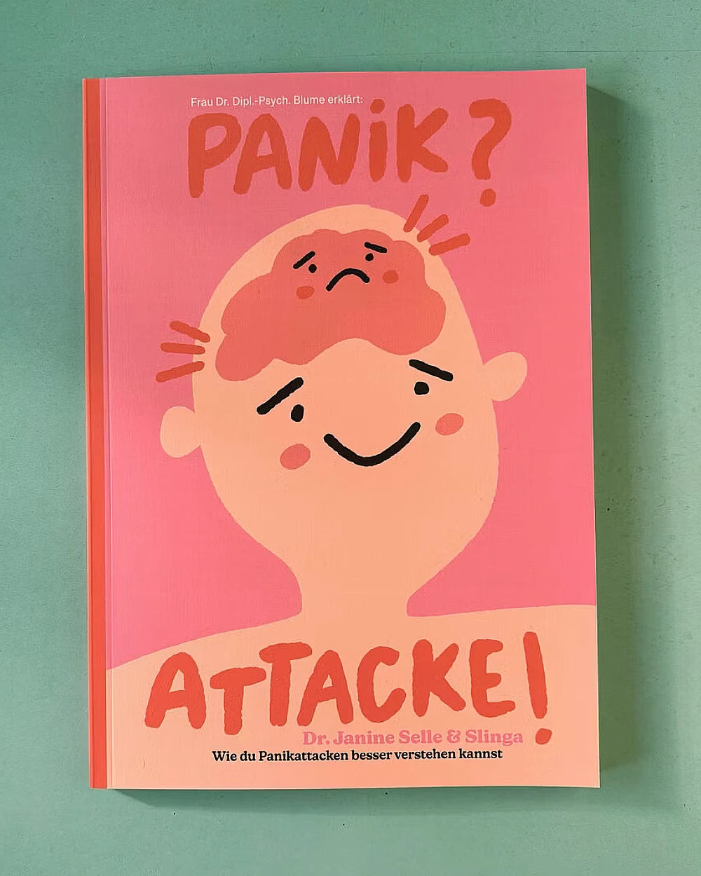 Buchcover von Panik? Attacke! zeigt eine Illustration mit Kopf und Gehirn. Autoren: Dr. Janine Selle, Slinga. Thema: Verständnis von Panikattacken.