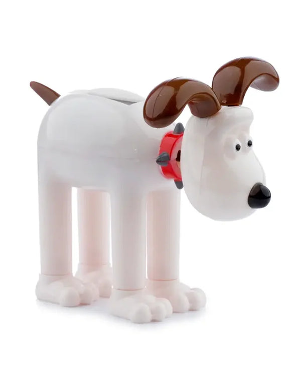 Gromit Solar Pal Wackelfigur, weiße Cartoon-Hundefigur mit braunen Ohren, rotem Halsband und langen Beinen, aus Kunststoff und Metall, 6 x 9 cm.