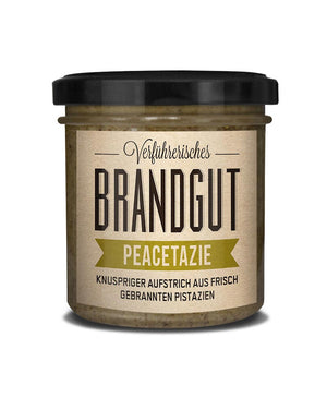 Peacetazie - Creme aus gebrannten Pistazien mit Meersalz in einem Glas, präsentiert als knuspriger Aufstrich. Enthält natürliche Zutaten, ohne Zusatzstoffe, von Brandgut.