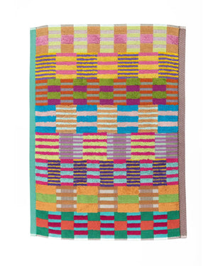 Bunte Odds & Ends Badematte #74 Tulip Quilt aus 100% Baumwolle, 60 x 80 cm, mit lebhaften gestreiften Farbblöcken und Aufhängeetikett, gefertigt in Portugal.