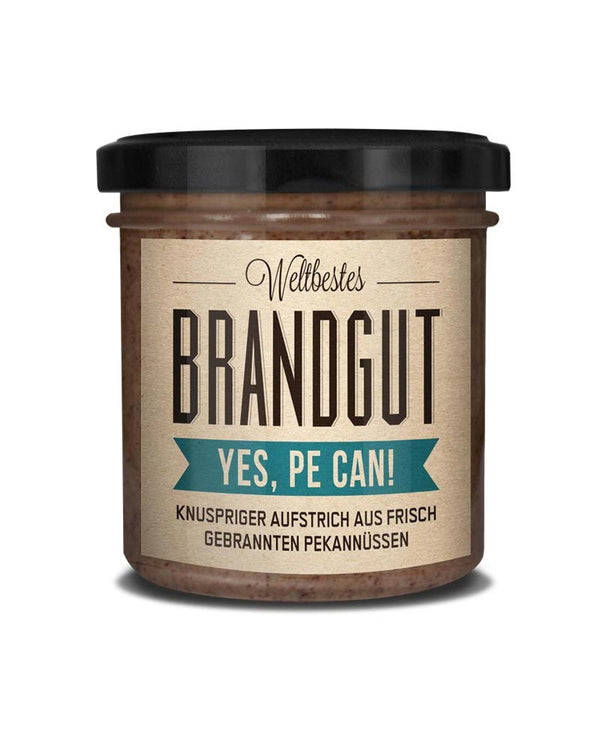 Glas mit Yes! Pe can!-Creme aus gebrannten Pekannüssen mit Meersalz, knuspriger Aufstrich ohne Zusatzstoffe, von Brandgut, erhältlich im Human Empire Shop.